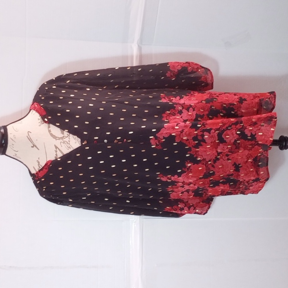 A black and dark red floral printed blouse with gold dotted overlay design.